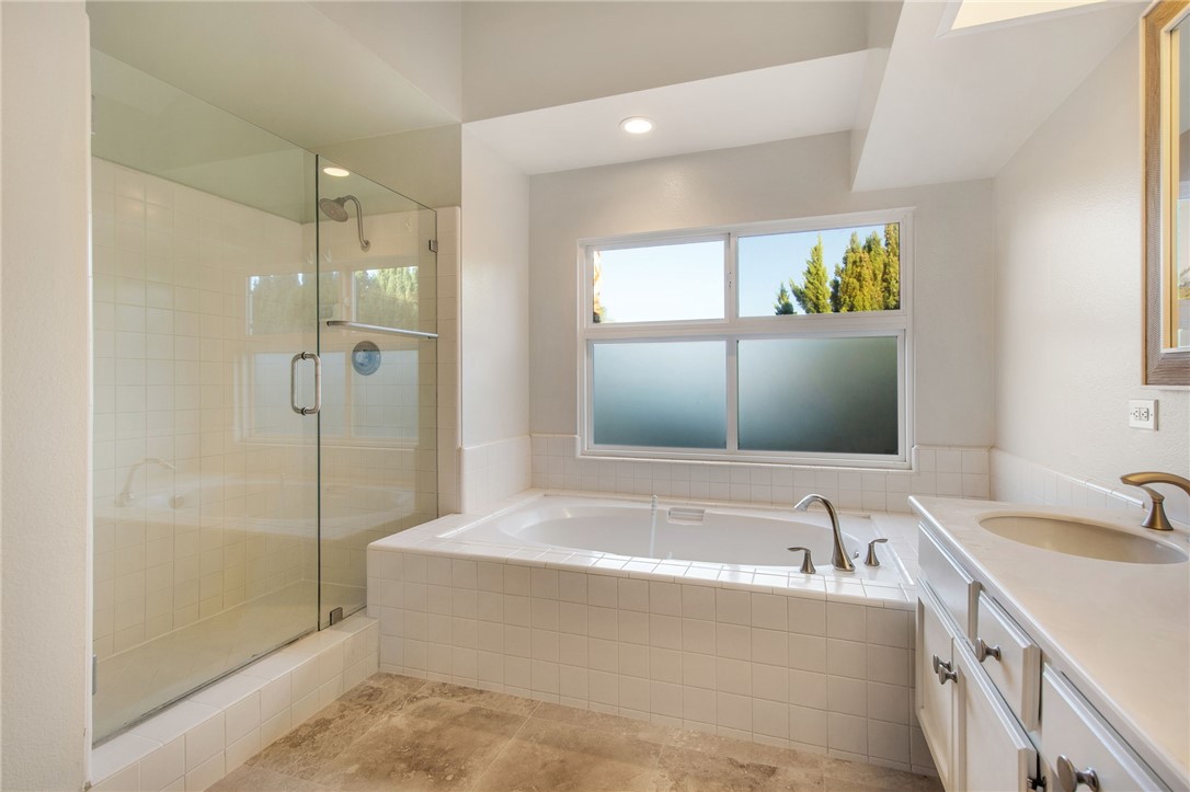 30 St Michael Dana Point, CA 92629 - Photo 23 of 33 a bathroom with a tub sink and mirror