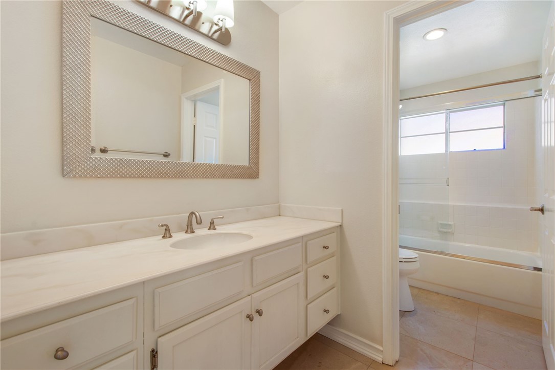 30 St Michael Dana Point, CA 92629 - Photo 28 of 33 a bathroom with a sink a vanity and a mirror