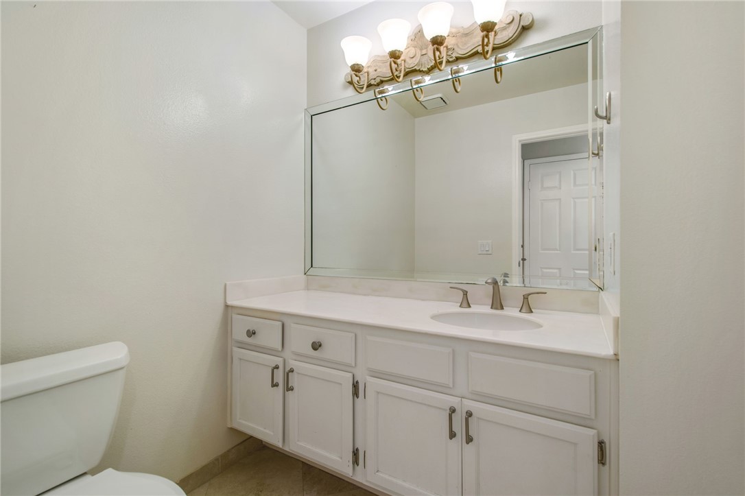 30 St Michael Dana Point, CA 92629 - Photo 31 of 33 a bathroom with a sink a toilet and mirror
