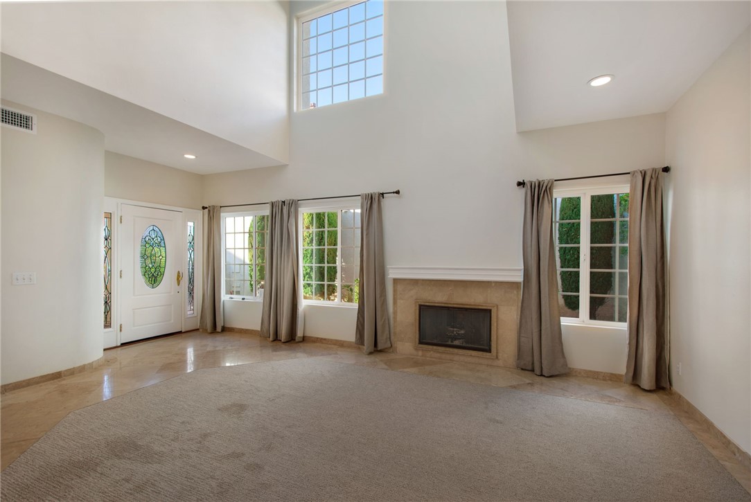 30 St Michael Dana Point, CA 92629 - Photo 7 of 33 an empty room with furniture and a fireplace