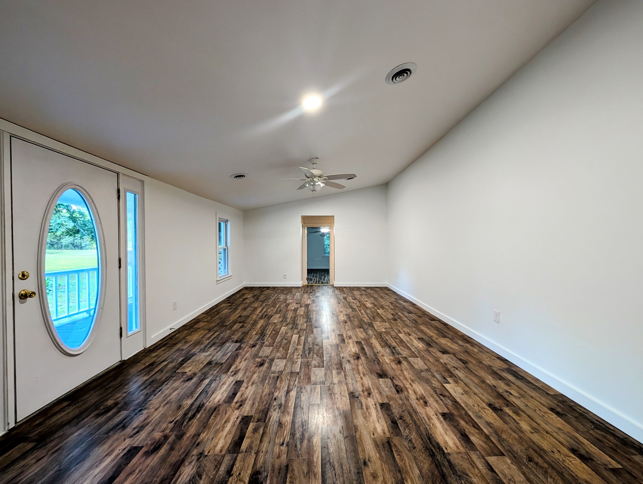 637 Robinson Road Centerville, TN 37033 - Photo 2 of 19 a view of empty room with window and wooden floor