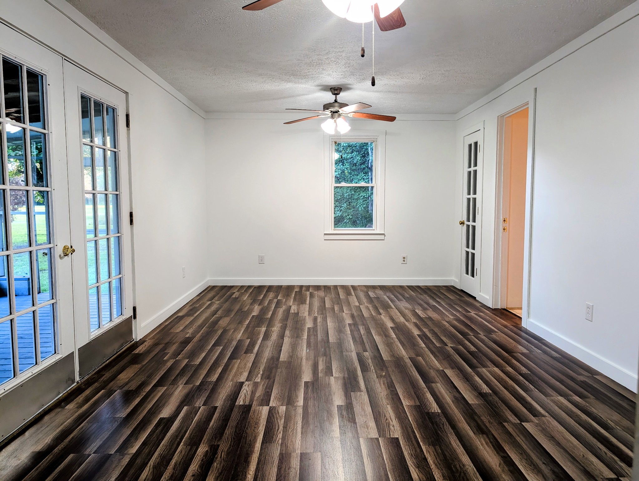 637 Robinson Road Centerville, TN 37033 - Photo 3 of 19 wooden floor in an empty room with a window