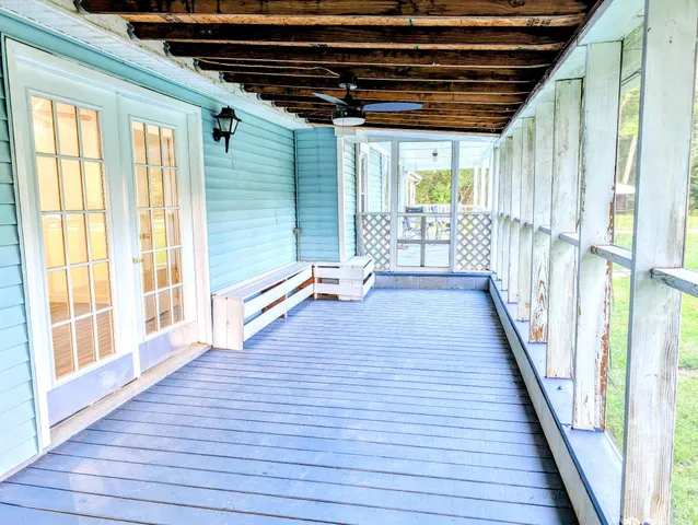 a kitchen with granite countertop cabinets and window