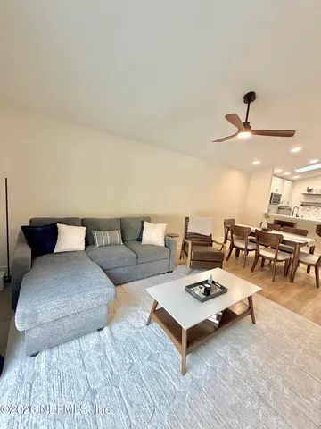 a living room with furniture and a table