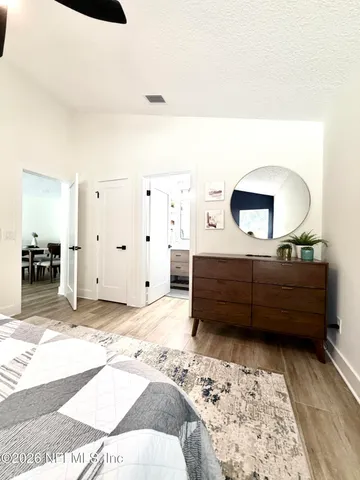 a bedroom with a bed and a cabinets
