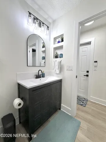 a bathroom with a sink and a mirror