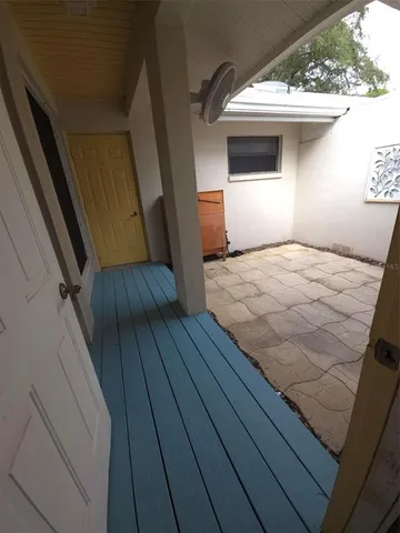 a view of a backyard with swimming pool