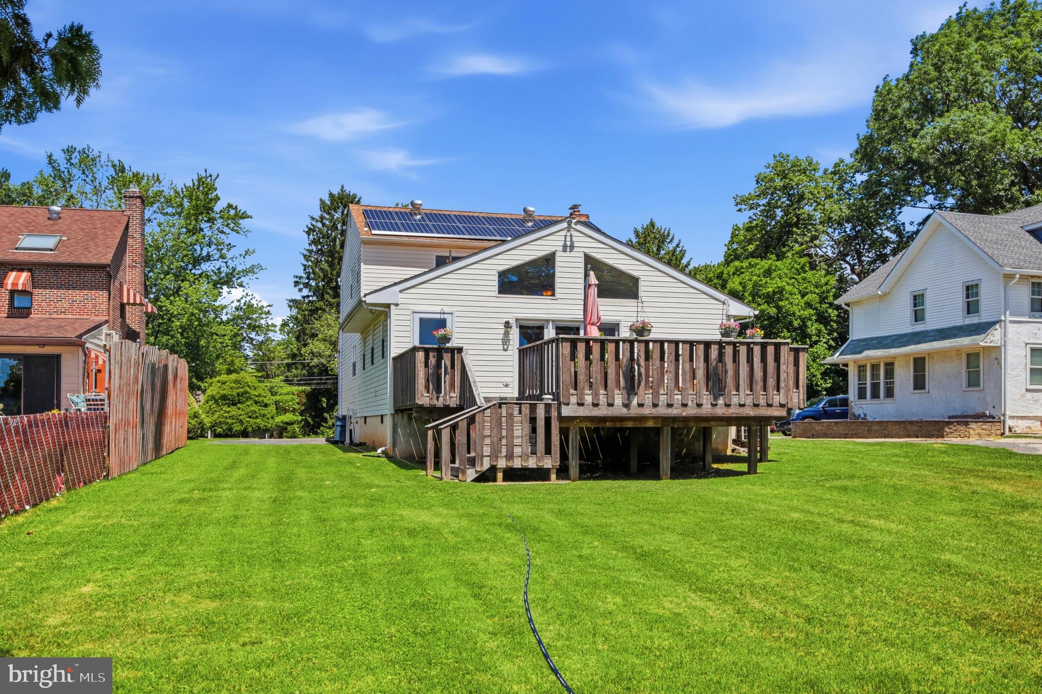 1004 Green Lane Secane, PA 19018 - Photo 34 of 49 a view of a house with a yard and deck