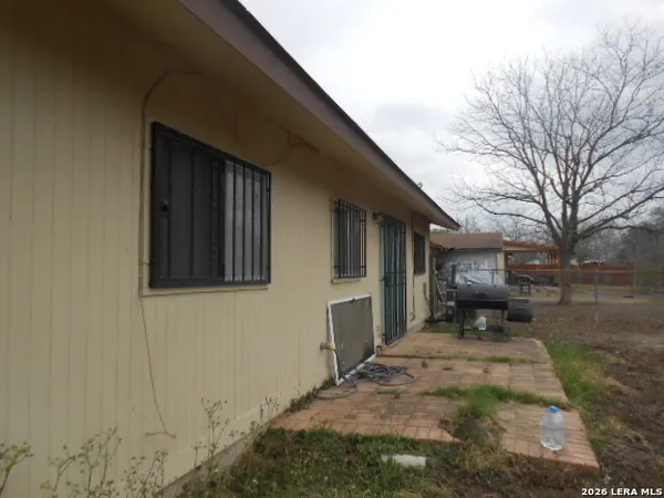 a backyard of a house with yard outdoor seating and garage