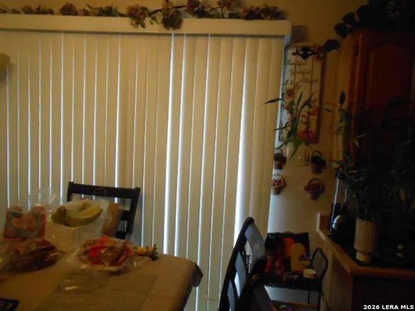 a bed room with a bed and a chair