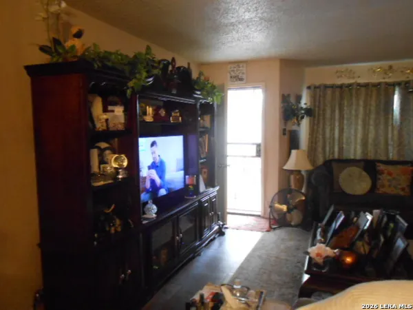a living room with furniture and window