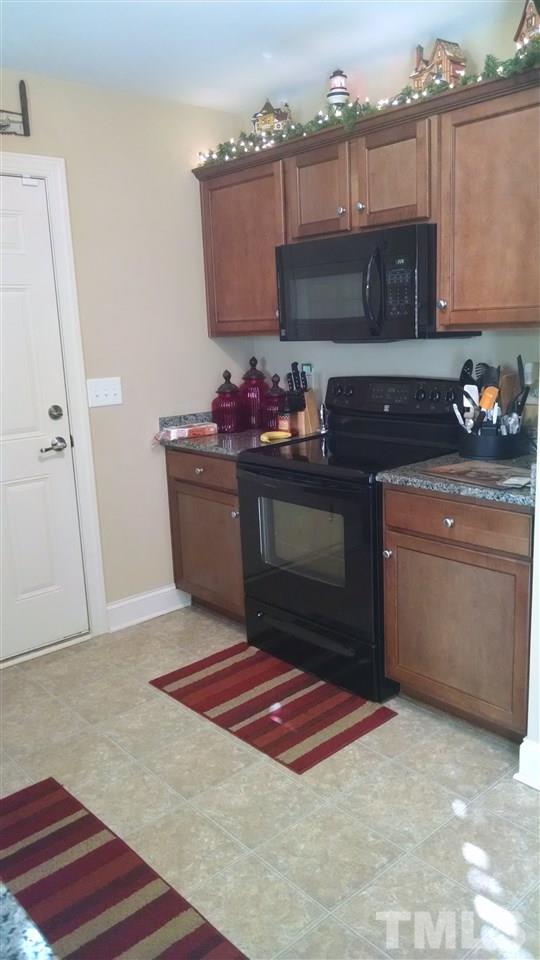 108 Orkney Road Stem, NC 27581 - Photo 17 of 22 a kitchen with a stove and a microwave