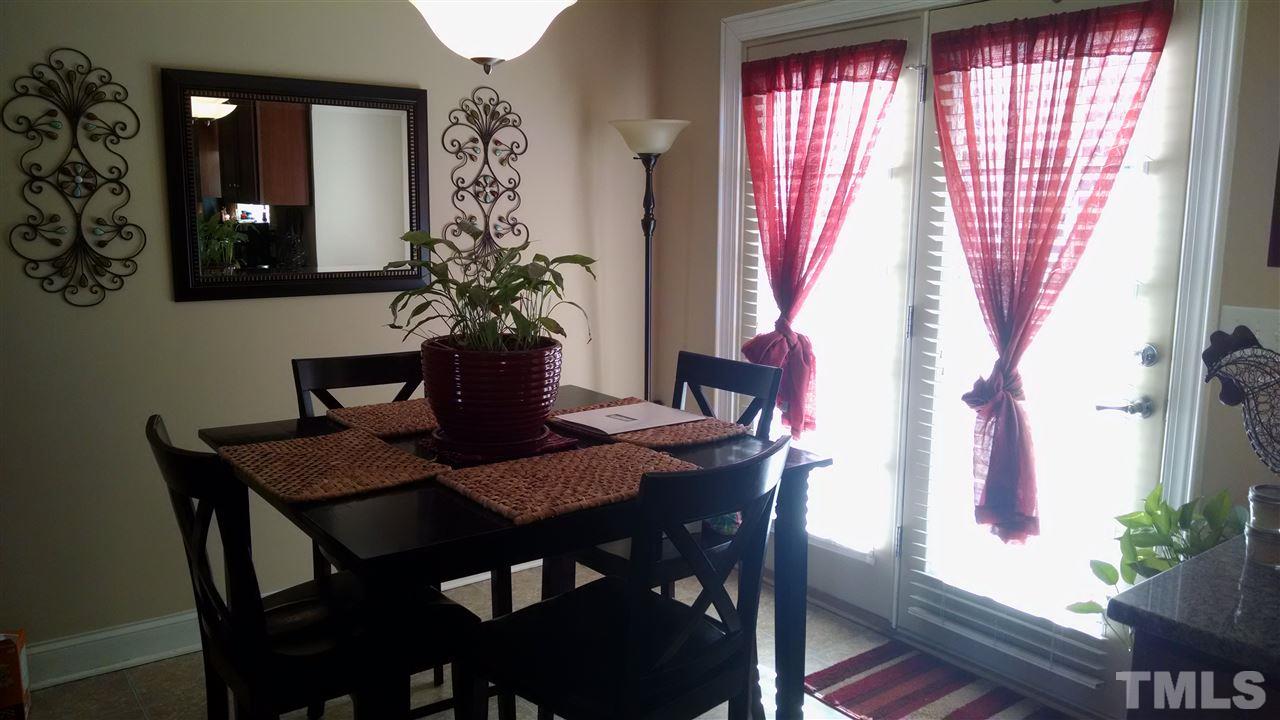 108 Orkney Road Stem, NC 27581 - Photo 18 of 22 a view of a dining room with furniture and window