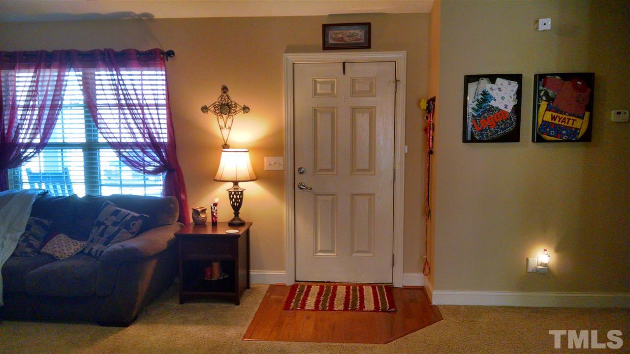 108 Orkney Road Stem, NC 27581 - Photo 3 of 22 a living room with furniture and a lamp