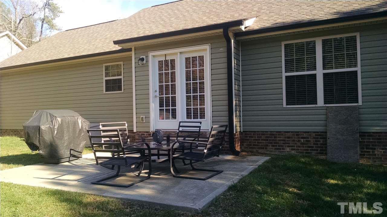 108 Orkney Road Stem, NC 27581 - Photo 21 of 22 a view of a backyard with sitting area
