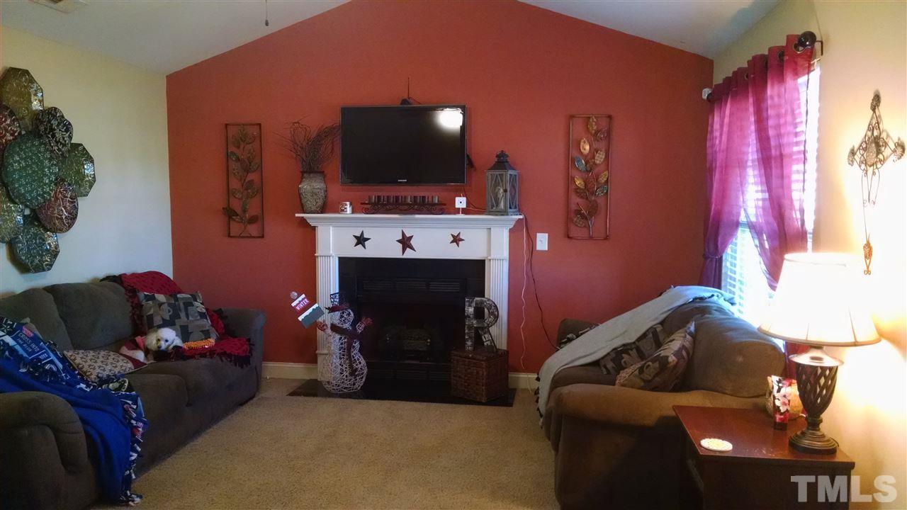 108 Orkney Road Stem, NC 27581 - Photo 4 of 22 a living room with furniture and a flat screen tv