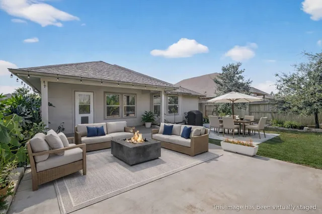 a view of a patio with couches and chairs