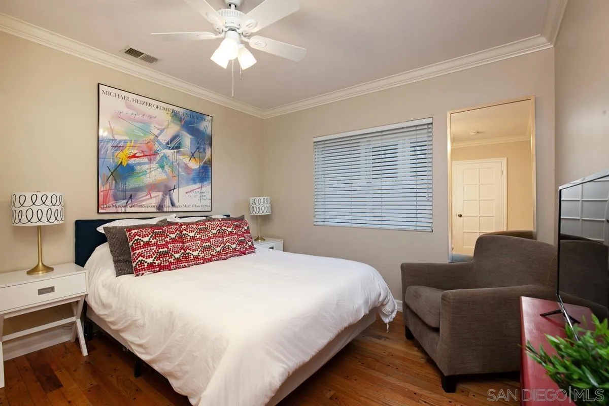3973 8th Avenue San Diego, CA 92103 - Photo 12 of 21 a bedroom with a bed couch and a window