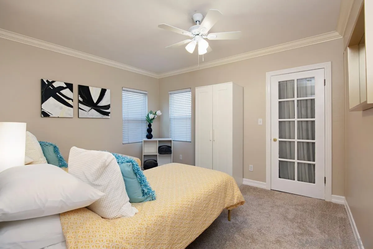 3973 8th Avenue San Diego, CA 92103 - Photo 14 of 21 a bedroom with a bed and a painting on the wall