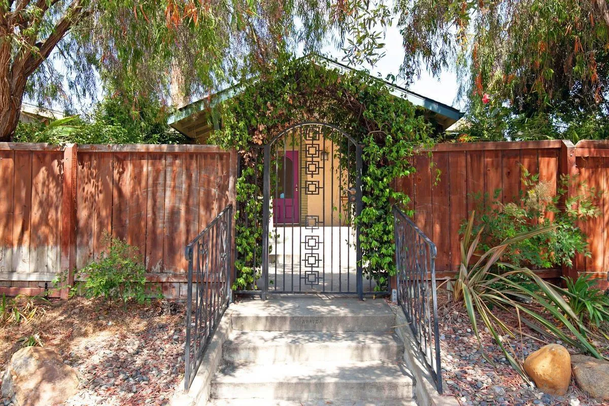 3973 8th Avenue San Diego, CA 92103 - Photo 19 of 21 a front view of a house with a yard and plants