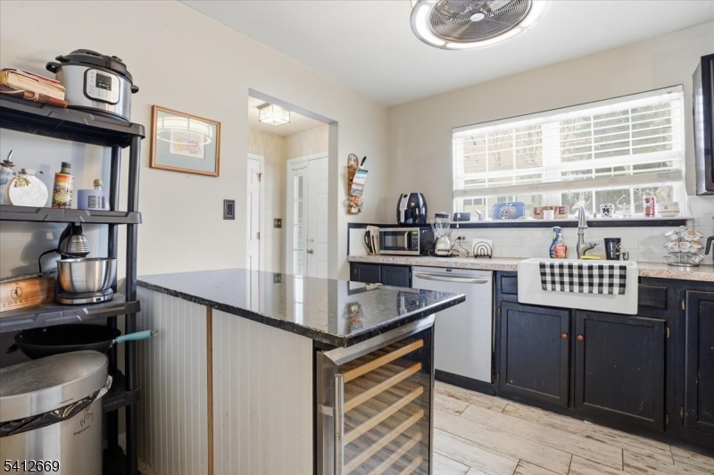 76 Hickory Way Mount Arlington, NJ 07856 - Photo 11 of 25 a kitchen with stainless steel appliances granite countertop a sink and a refrigerator