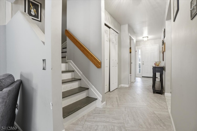 76 Hickory Way Mount Arlington, NJ 07856 - Photo 12 of 25 a view of entryway and hall with wooden floor