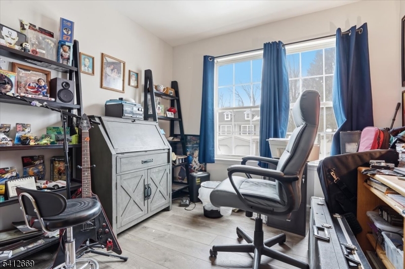 76 Hickory Way Mount Arlington, NJ 07856 - Photo 16 of 25 a view of a workspace with furniture and a window