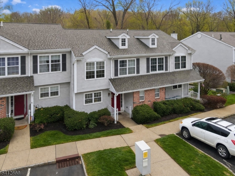76 Hickory Way Mount Arlington, NJ 07856 - Photo 3 of 25 a front view of a house with a yard