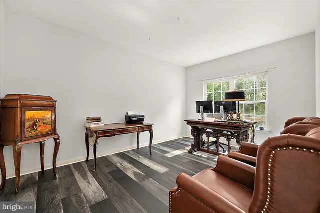 a kitchen with stainless steel appliances kitchen island granite countertop a stove a sink and a refrigerator