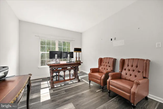 a kitchen with kitchen island granite countertop a sink a center island stainless steel appliances and cabinets