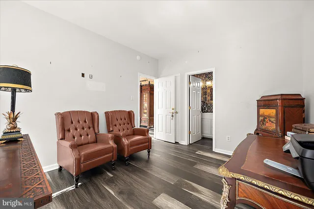 a large kitchen with a table and chairs