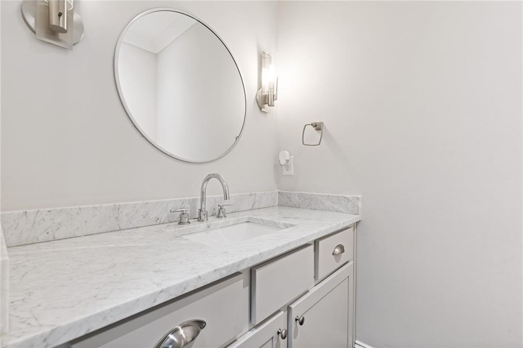 1560 Tapestry Ridge Southeast Lawrenceville, GA 30045 - Photo 11 of 57 a bathroom with a sink and a mirror