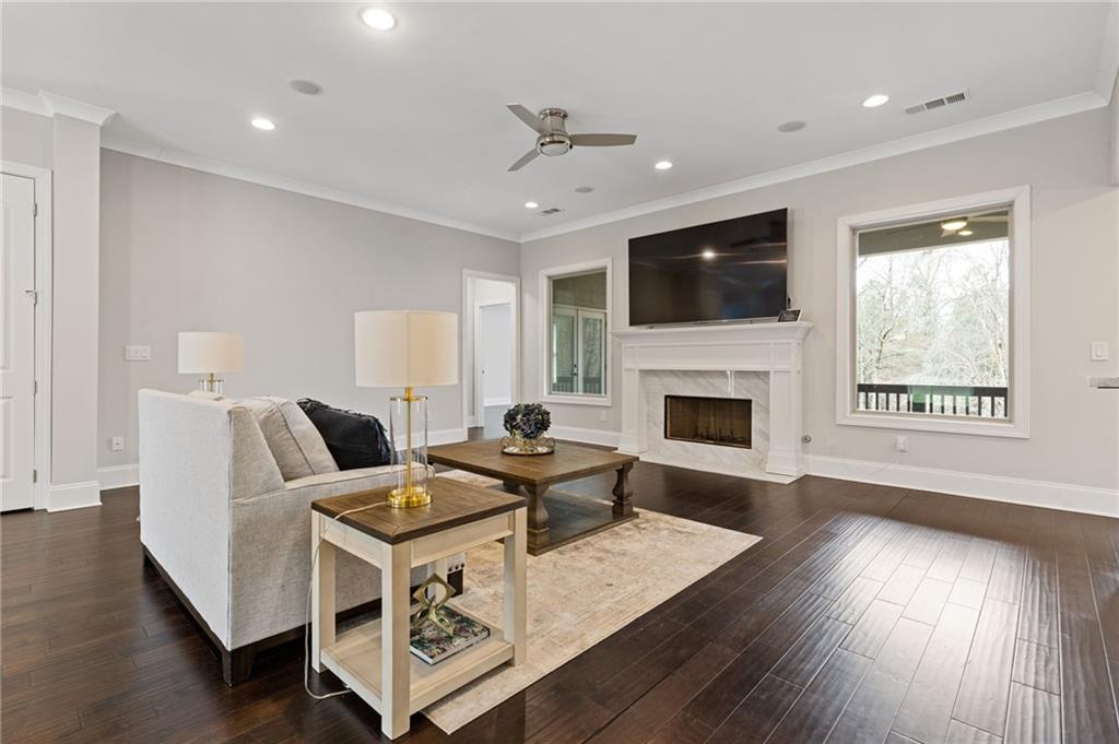 1560 Tapestry Ridge Southeast Lawrenceville, GA 30045 - Photo 12 of 57 a living room with furniture fireplace and flat screen tv