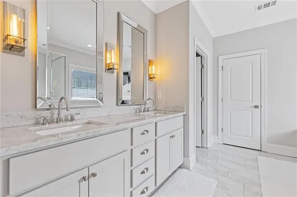 a bathroom with a bathtub and shower