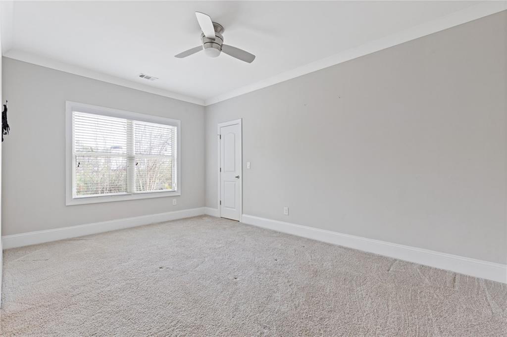1560 Tapestry Ridge Southeast Lawrenceville, GA 30045 - Photo 25 of 57 a view of an empty room with a window
