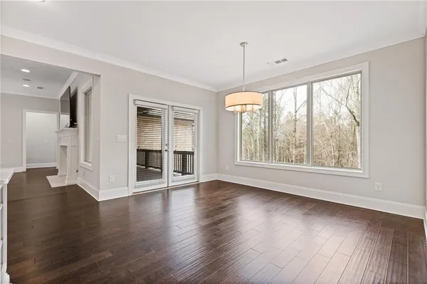 a view of kitchen with wooden floor and window
