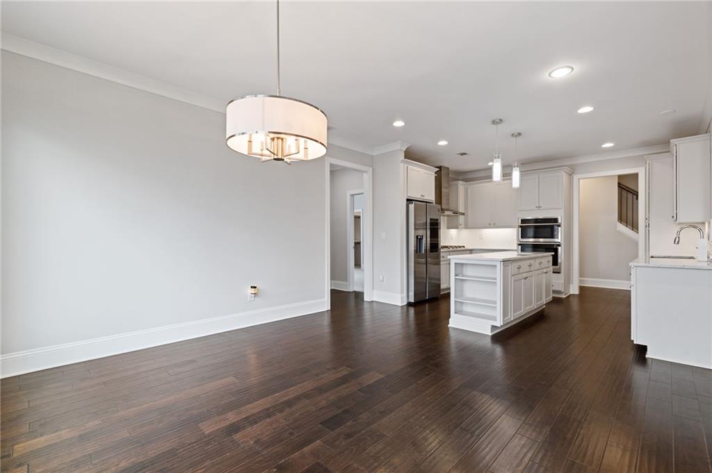 1560 Tapestry Ridge Southeast Lawrenceville, GA 30045 - Photo 28 of 57 a view of kitchen with wooden floor and window