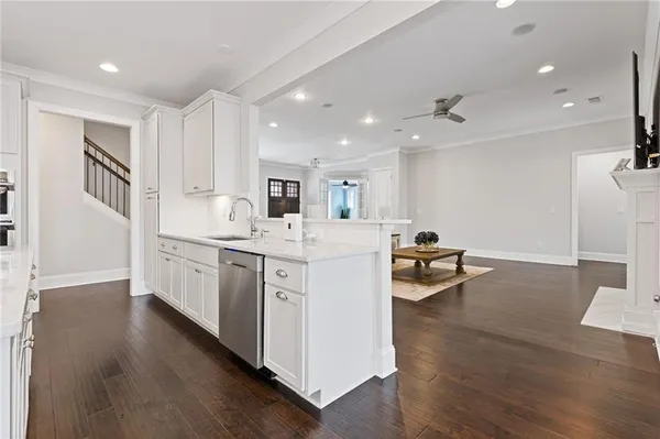 a kitchen with center island and windows