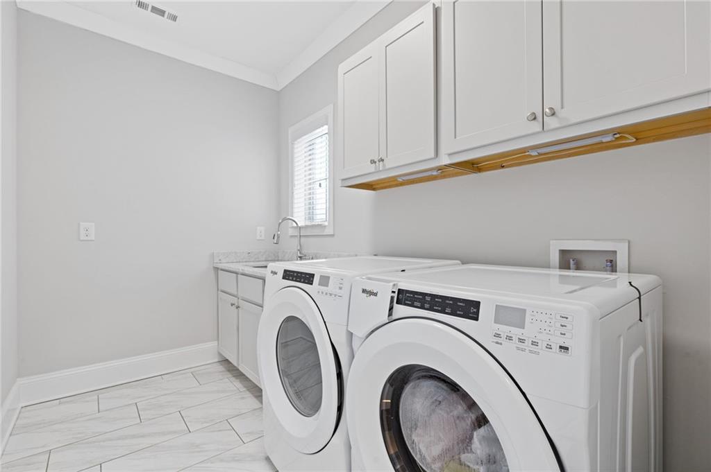 1560 Tapestry Ridge Southeast Lawrenceville, GA 30045 - Photo 33 of 57 a utility room with dryer and washer