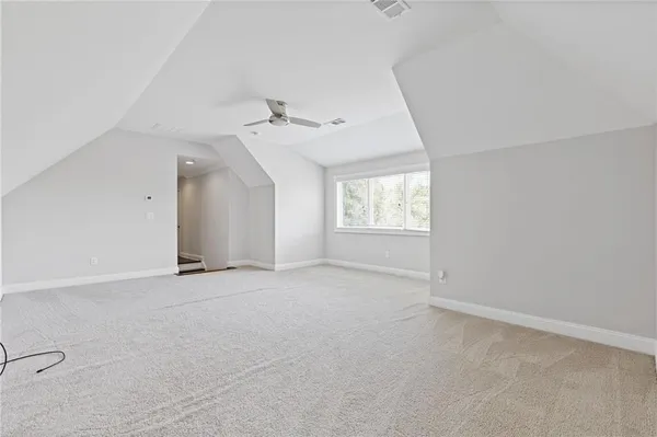 a view of empty room with a fireplace