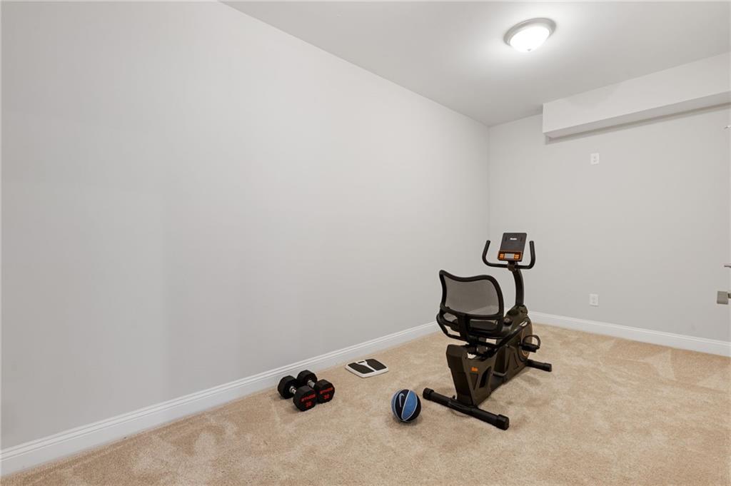 1560 Tapestry Ridge Southeast Lawrenceville, GA 30045 - Photo 45 of 57 a view of a room with gym equipment