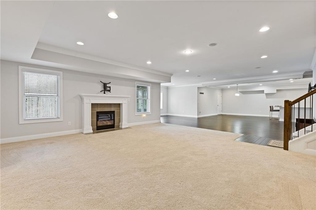 1560 Tapestry Ridge Southeast Lawrenceville, GA 30045 - Photo 46 of 57 a view of an empty room with a fireplace and a window