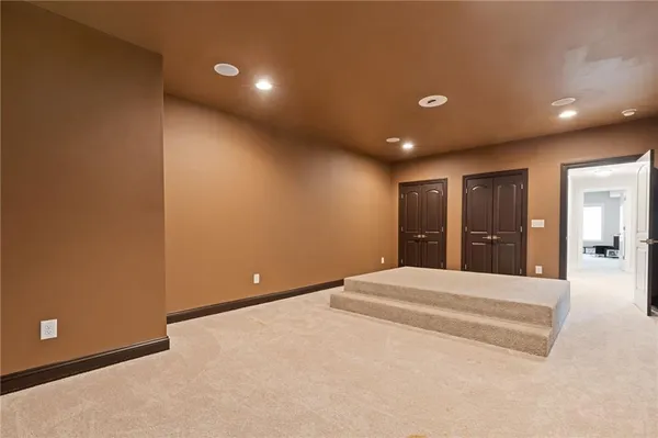 a view of balcony with wooden floor and fence