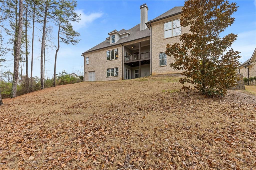 1560 Tapestry Ridge Southeast Lawrenceville, GA 30045 - Photo 53 of 57 a front view of a house with a yard