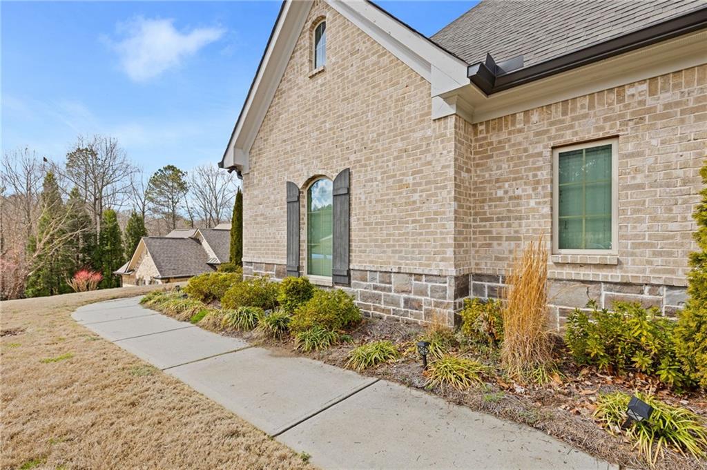 1560 Tapestry Ridge Southeast Lawrenceville, GA 30045 - Photo 7 of 57 a front view of a house with garden