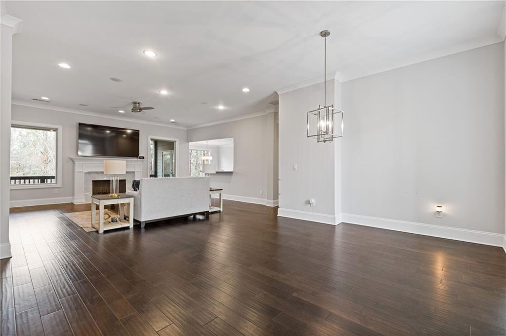 1560 Tapestry Ridge Southeast Lawrenceville, GA 30045 - Photo 8 of 57 a view of livingroom with furniture wooden floor and window