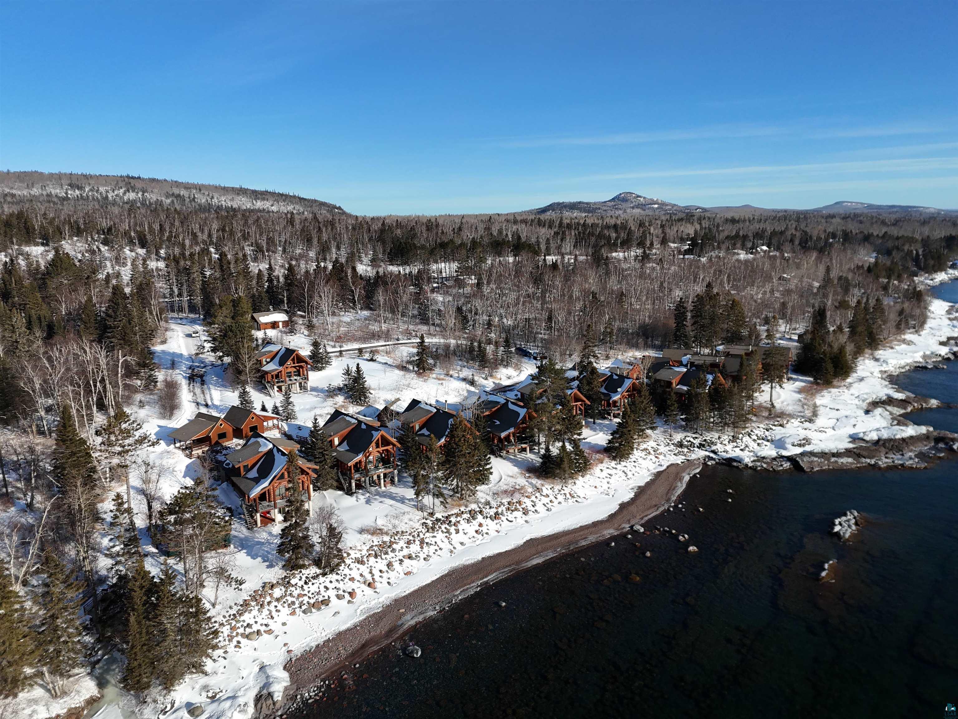 Snowy aerial view with a mountain view