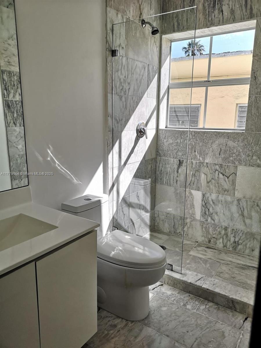 810 7th Street, Unit 203 Miami Beach, FL 33139 - Photo 7 of 7 a view of bathroom and shower