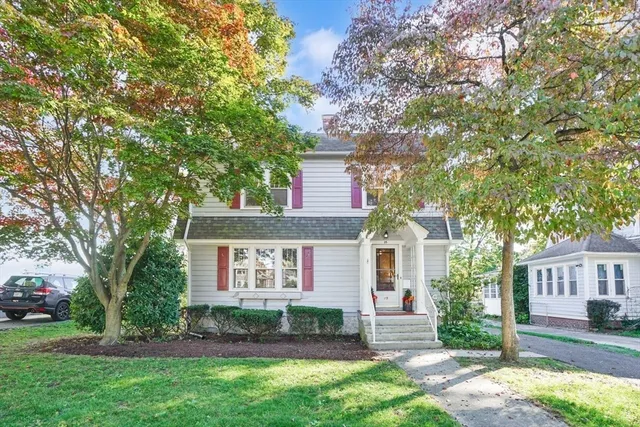 front view of a house with a yard