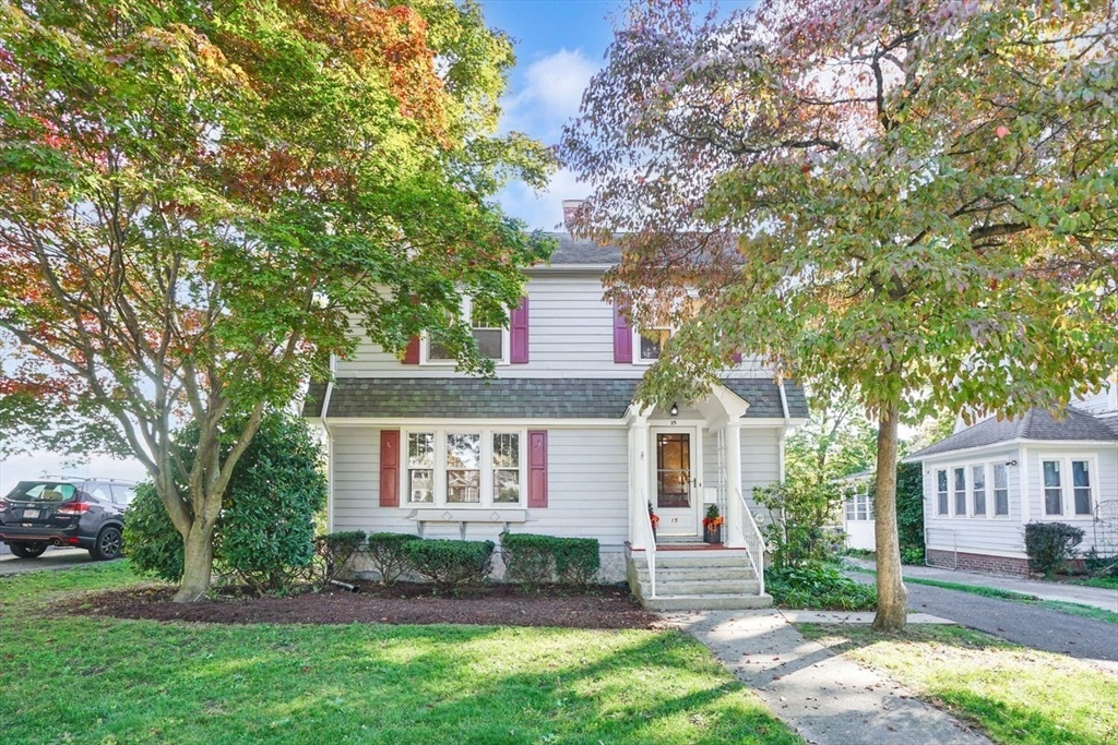 front view of a house with a yard